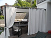 Gazebo realizzato con struttura in ferro verniciata e possilica con teli a scorrimento sulla parte superiore e teli a strappo sulla parte laterale.