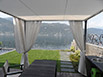 Gazebo realizzato con struttura in ferro verniciata e possilica con teli a scorrimento sulla parte superiore e teli a strappo sulla parte laterale.