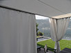 Gazebo realizzato con struttura in ferro verniciata e possilica con teli a scorrimento sulla parte superiore e teli a strappo sulla parte laterale.